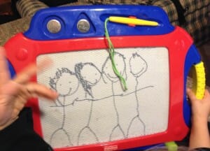 Kimmie's 2014 portrait of our family: left to right, Essie, Kimmie, me, and my dear husband