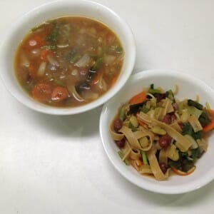 A bowl of grownup soup and a bowl of kiddo solids