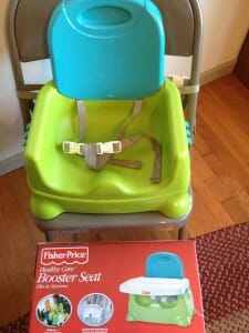 Our first booster seat for Kimmie, the Fisher-Price Booster Seat, began doubling as Essie's highchair as soon as Essie started solids.