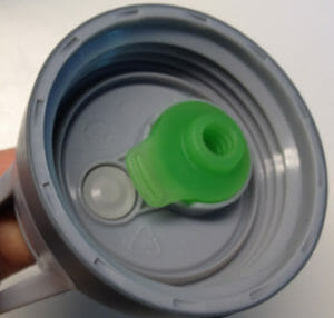 If that green part isn't properly inserted into the lid, your Camelbak water bottlewill leak all over.