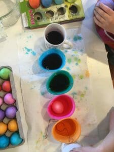dyeing Easter eggs with kids is messy