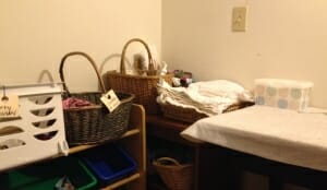 The baskets near my downstairs changing table include an easily-washable plastic one for dirty clothes.