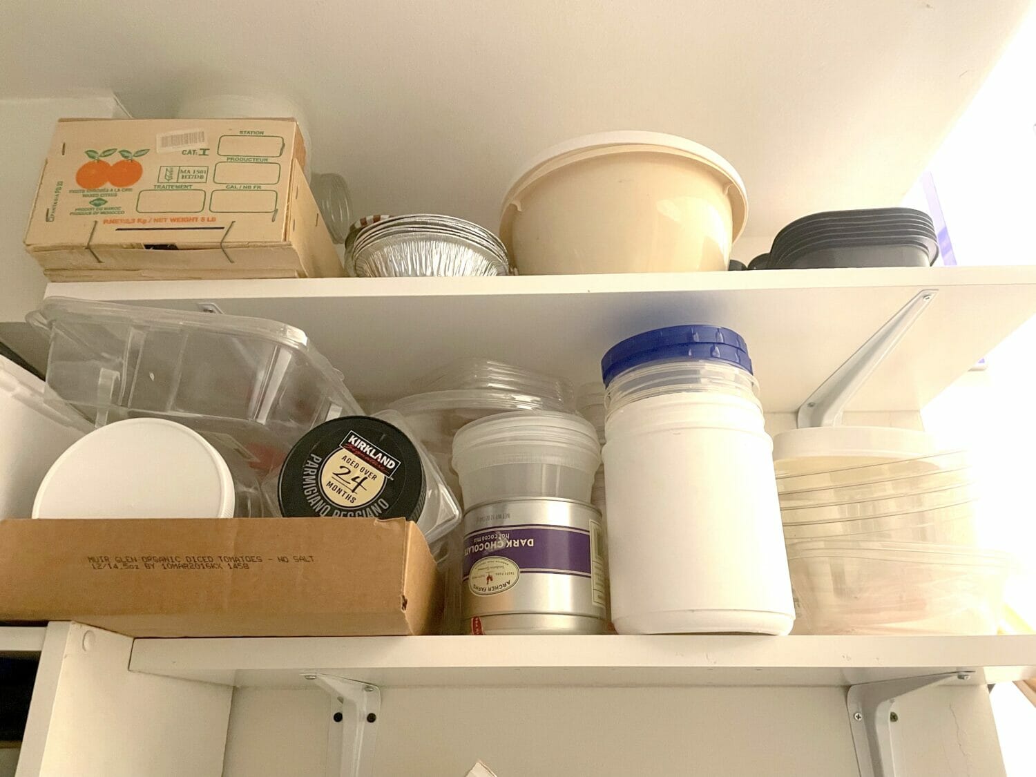 Overhead shelves are my favorite small space storage hack, and make for easy DIY organizing small spaces cheap.