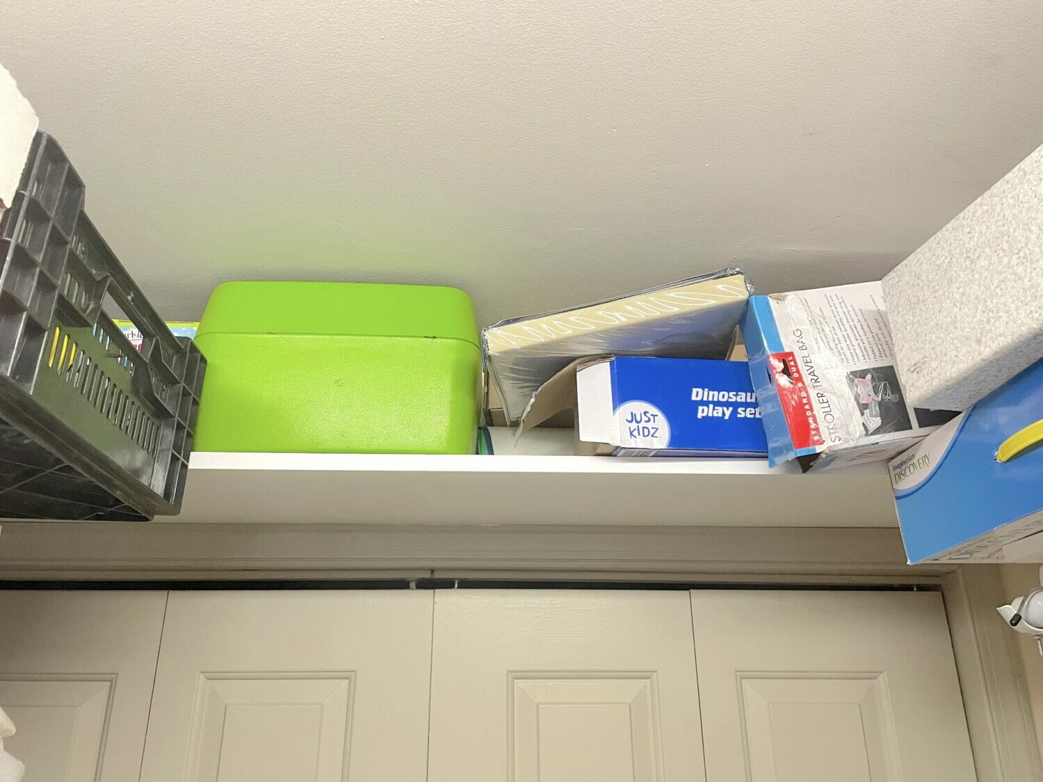 Overhead shelves are my favorite small space storage hack, and make for easy DIY organizing small spaces cheap.