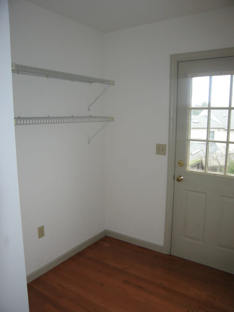 Before: The wire shelving that was here when we moved in wouldn't work for storing binders and office supplies, so down it went; I repurposed it as the new shelving in our basement laundry-supply corner.