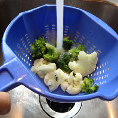 rinsing steamed veggies