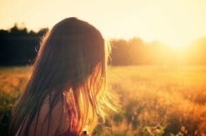 girl outdoors at sunset