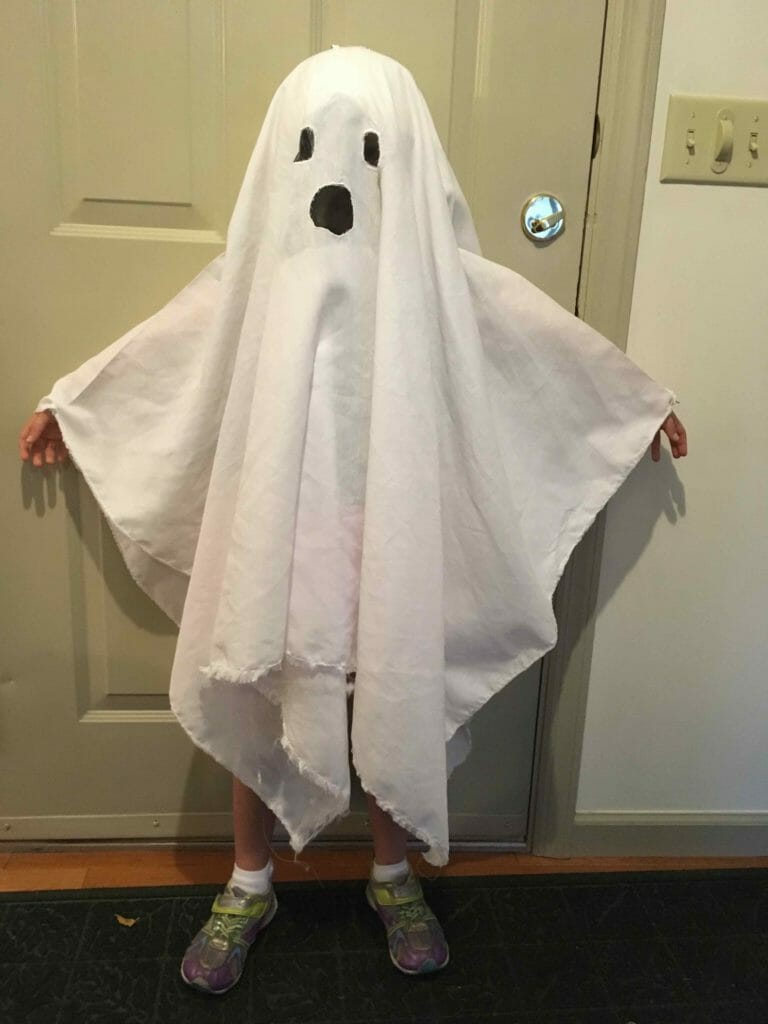 Kimmie, wearing her finished ghost costume, demonstrates why the wrist straps are especially useful.