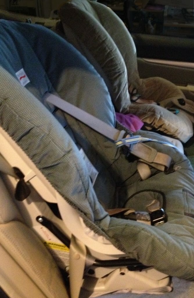 Our old toddler carseats: neither fun to haul, nor fun to install