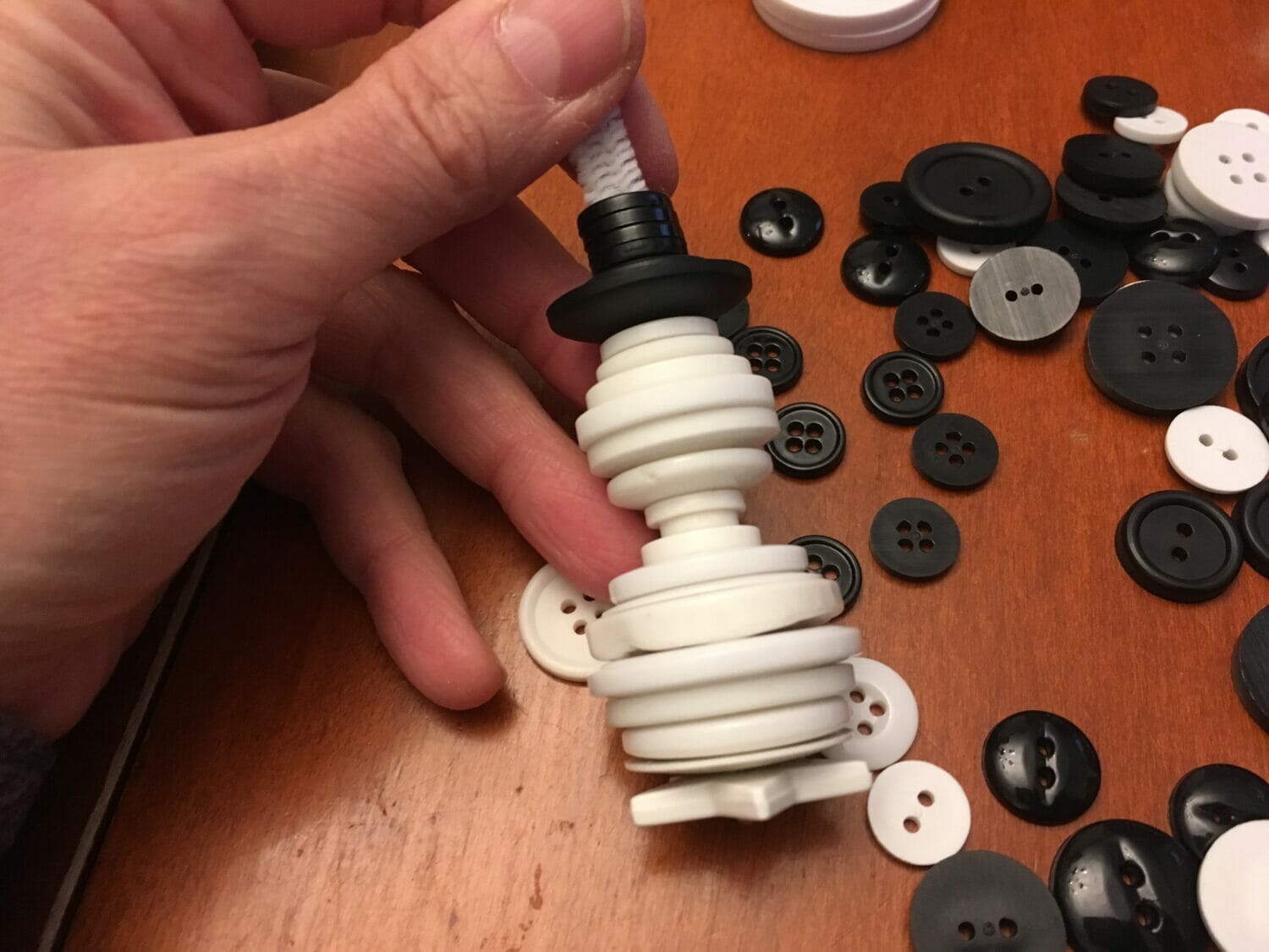 These cute button snowman ornaments make great DIY Christmas gifts while helping little hands practice sorting and fine motor skills.