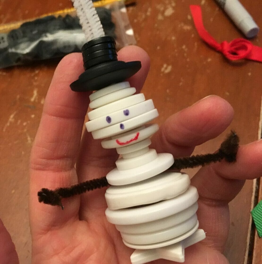 These cute button snowman ornaments make great DIY Christmas gifts while helping little hands practice sorting and fine motor skills.