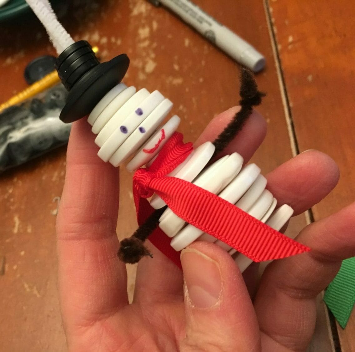 These cute button snowman ornaments make great DIY Christmas gifts while helping little hands practice sorting and fine motor skills.