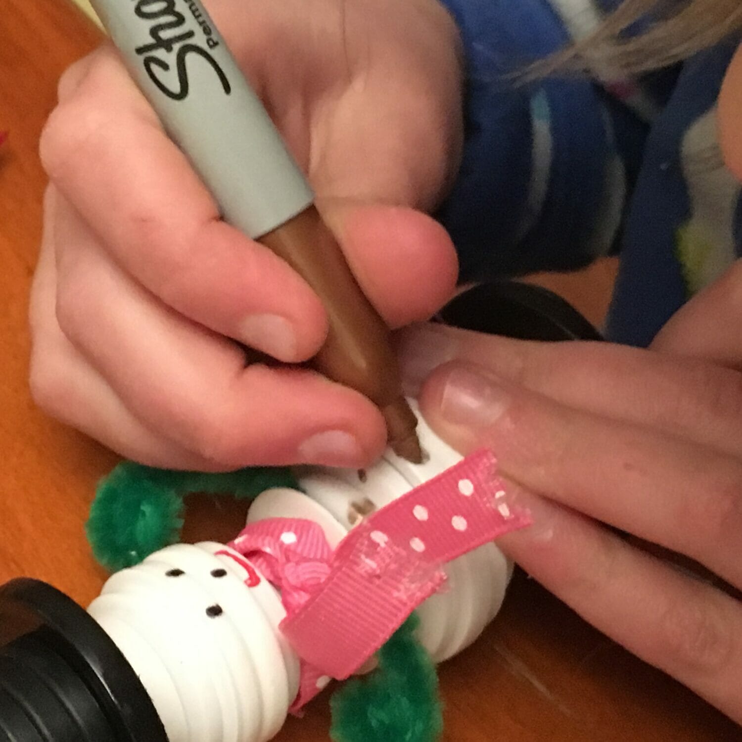 These cute button asnowman ornaments make great DIY Christmas gifts while helping little hands practice sorting and fine motor skills.