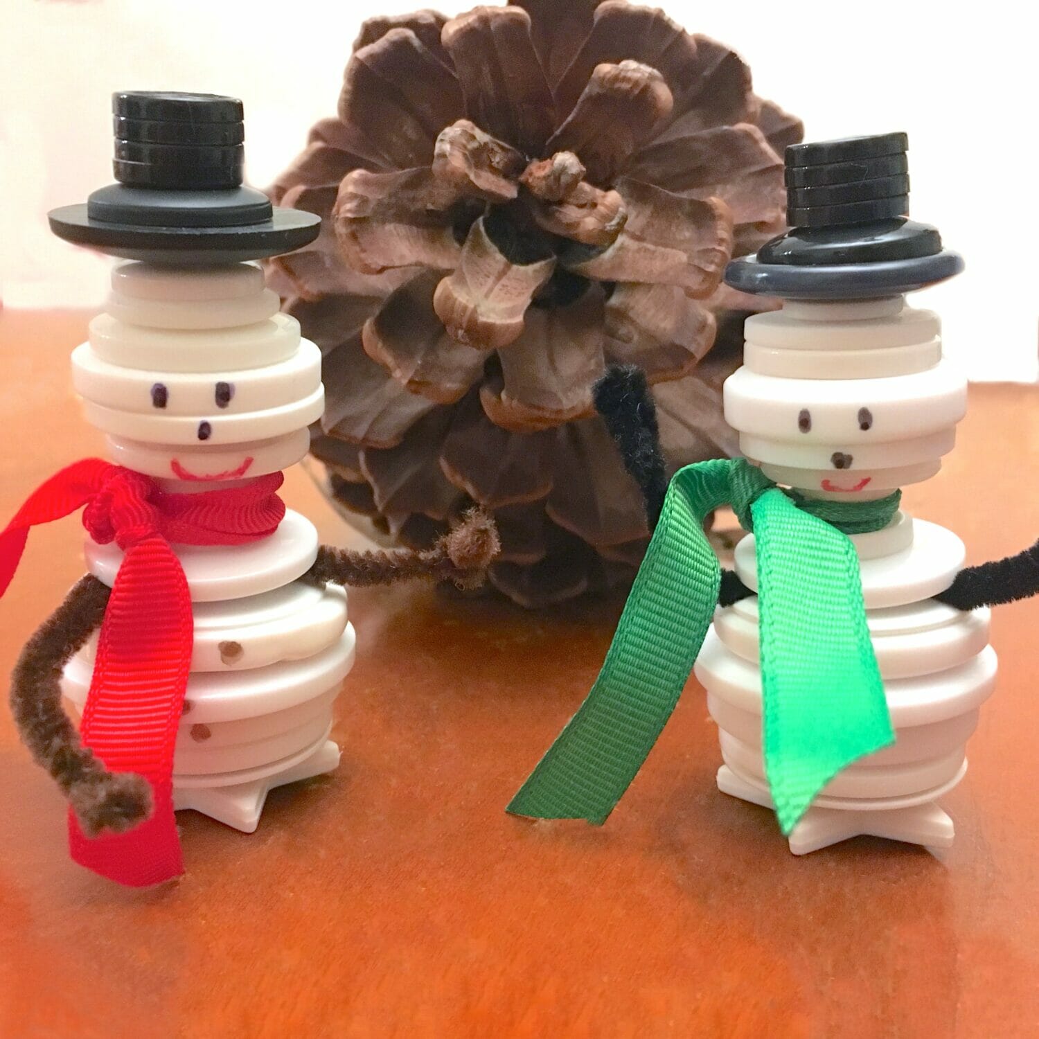 These cute button snowman ornaments make great DIY Christmas gifts while helping little hands practice sorting and fine motor skills.